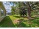 Spacious backyard with mature trees and lush lawn at 1746 Golfview Dr, Kissimmee, FL 34746