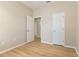 Bedroom features wood floors, a doorway, and neutral colored walls at 1746 Golfview Dr, Kissimmee, FL 34746