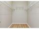 Walk-in closet with wire shelving and hardwood floors at 1746 Golfview Dr, Kissimmee, FL 34746