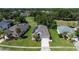 Overhead view of home with solar panels, landscaped front yard, and driveway at 1746 Golfview Dr, Kissimmee, FL 34746