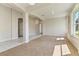 Open living room with carpet and tile, featuring views to multiple rooms and ample natural light at 1746 Golfview Dr, Kissimmee, FL 34746