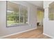 Living room with neutral walls and view of backyard at 1746 Golfview Dr, Kissimmee, FL 34746