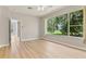 Large living room with luxury floors, two closets and large window at 1746 Golfview Dr, Kissimmee, FL 34746
