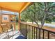 Balcony view with seating of nearby buildings and vegetation at 203 La Mirage St, Davenport, FL 33897