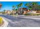 Gated entrance to Regal Palms, surrounded by palm trees with ample parking at 203 La Mirage St, Davenport, FL 33897