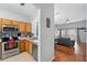 Modern kitchen featuring stainless steel appliances and open layout leading to the living room at 203 La Mirage St, Davenport, FL 33897