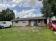 Modest single-story home featuring a simple front yard, awaiting a touch of landscaping at 2329 W Doris St, Kissimmee, FL 34741