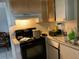 Kitchen with original details, including cabinets and fixtures, ready for renovation at 2329 W Doris St, Kissimmee, FL 34741