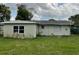 The rear exterior of this home shows its simple construction and layout at 2329 W Doris St, Kissimmee, FL 34741