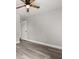 This bedroom features wood-look flooring and a modern ceiling fan fixture at 2421 Deermeadow Dr, Apopka, FL 32703