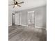 Large bedroom featuring hardwood floors, ample closet space, and an attached bathroom at 2421 Deermeadow Dr, Apopka, FL 32703