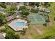 Aerial view of community featuring pool, tennis courts, and lounge chairs at 2421 Deermeadow Dr, Apopka, FL 32703