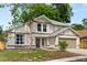 Charming two-story home featuring neutral paint, attached two car garage, and well-maintained lawn at 2421 Deermeadow Dr, Apopka, FL 32703