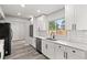 Bright kitchen with white cabinets, stainless steel appliances, and a functional design at 2421 Deermeadow Dr, Apopka, FL 32703