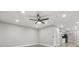 Open living room with ceiling fan and recessed lighting adjacent to the kitchen at 2421 Deermeadow Dr, Apopka, FL 32703