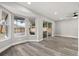 Sunlit Florida room with large windows and a sliding door, offering tranquil outdoor views at 2421 Deermeadow Dr, Apopka, FL 32703