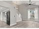 Open-concept living area with vaulted ceilings, modern finishes, and abundant natural light at 2421 Deermeadow Dr, Apopka, FL 32703