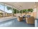 Spacious screened patio with outdoor seating and view of the backyard at 2421 Deermeadow Dr, Apopka, FL 32703