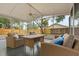 Large screened-in patio featuring comfortable seating and backyard views at 2421 Deermeadow Dr, Apopka, FL 32703