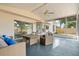 Relaxing covered patio with furniture, ceiling fan, and a view of the fenced-in yard at 2421 Deermeadow Dr, Apopka, FL 32703