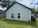 Home's backyard featuring a well-maintained lawn and privacy fence at 2453 Sipes Ave, Sanford, FL 32771