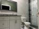 Bathroom with new vanity, granite countertop, and tiled shower at 2453 Sipes Ave, Sanford, FL 32771