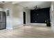 Open-concept living area featuring new flooring and a modern ceiling fan at 2453 Sipes Ave, Sanford, FL 32771
