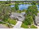Scenic aerial view of a single Gathering home with a large front yard and a serene lake in the background at 248 Country Landing Blvd, Apopka, FL 32703