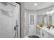 Modern bathroom features a walk-in shower, single sink vanity and a door to the outside at 248 Country Landing Blvd, Apopka, FL 32703