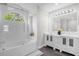 Elegant bathroom with double vanity sinks, bathtub with shower and tiled walls with decorative showerhead at 248 Country Landing Blvd, Apopka, FL 32703