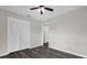 Bedroom with a ceiling fan, white trim, gray flooring and a white closet at 248 Country Landing Blvd, Apopka, FL 32703