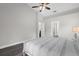 Spacious bedroom with a neutral color palette and a view into an adjoined bathroom at 248 Country Landing Blvd, Apopka, FL 32703