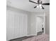 Bedroom features gray floors, white trim and a closet with white doors at 248 Country Landing Blvd, Apopka, FL 32703