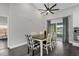 Bright dining area with stylish decor, sliding glass doors offering a view of the backyard, and lots of natural light at 248 Country Landing Blvd, Apopka, FL 32703