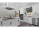 Well-equipped kitchen featuring stainless steel appliances, double oven, and a large island with cooktop at 248 Country Landing Blvd, Apopka, FL 32703
