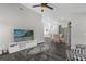 Open-concept living area with a dining area, and sleek modern decor, great for entertaining guests at 248 Country Landing Blvd, Apopka, FL 32703