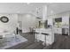 Open concept living space with kitchen island, dining area, and a view into the living room and bedroom at 248 Country Landing Blvd, Apopka, FL 32703