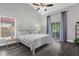 Cozy main bedroom with wood flooring, a ceiling fan and access to the patio at 248 Country Landing Blvd, Apopka, FL 32703