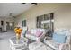 Relaxing outdoor patio featuring comfortable seating and access to the backyard at 248 Country Landing Blvd, Apopka, FL 32703