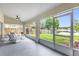 Spacious screened-in patio with views of the backyard and lake at 248 Country Landing Blvd, Apopka, FL 32703