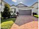 Charming single-Gathering home with well-maintained landscaping and a brick paved driveway at 2547 Trielle Ave, Kissimmee, FL 34741