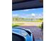 Beautiful lake view from the driveway of the house, with lush landscaping at 2547 Trielle Ave, Kissimmee, FL 34741