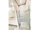 Modern shower in the main bathroom with glass doors and decorative tile accents at 2547 Trielle Ave, Kissimmee, FL 34741