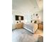 Serene main bedroom features neutral decor, a comfortable bed, and a mounted television at 2547 Trielle Ave, Kissimmee, FL 34741