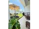 Inviting outdoor patio with dining set, umbrella, and comfortable seating at 2547 Trielle Ave, Kissimmee, FL 34741