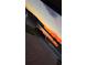 Striking sunset street view featuring car parked next to a picturesque lake at 2547 Trielle Ave, Kissimmee, FL 34741