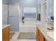 Well-lit bathroom showcasing a garden tub, neutral tones, and double vanities at 2567 Oneida Loop, Kissimmee, FL 34747