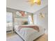 Inviting bedroom featuring a queen bed, tile flooring, and unique wall decorations at 2567 Oneida Loop, Kissimmee, FL 34747