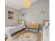 Charming bedroom featuring twin beds, space-themed decor, and a woven pendant light at 2567 Oneida Loop, Kissimmee, FL 34747
