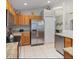 Spacious kitchen with stainless steel appliances, granite countertops, and wood cabinets at 2567 Oneida Loop, Kissimmee, FL 34747